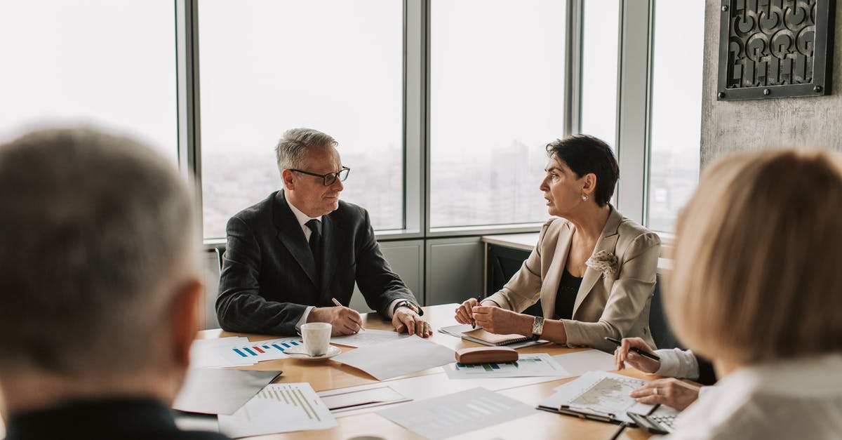 Testfor team score not working - Man in Black Suit Jacket Sitting Beside Woman in Beige Blazer Testfor team score not working - Man in Black Suit Jacket Sitting Beside Woman in Beige Blazer