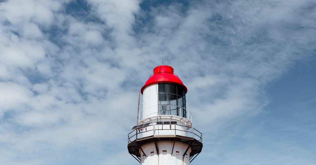 /testforblock command on beacon beam - Bright aged lighthouse under cloudy sky in daytime