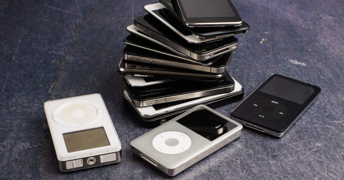 Testing for players within a specified rectangular area - Assorted portable media players and heap of aged cellphones with black screens on gray background