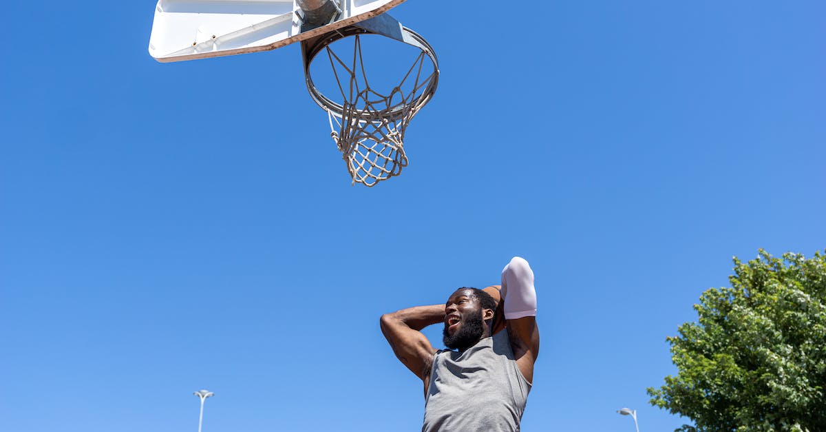 Testing what a player says - Man in White T-shirt Playing Basketball