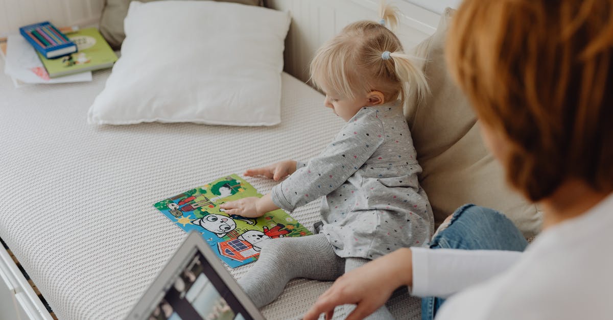 Tetris puzzle in the marsh with no use? - Girl Playing with a Jigsaw Puzzle and her Mother Using a Laptop