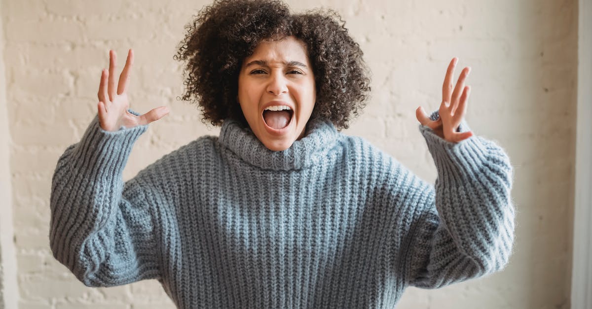 The Bee's Knees or Molten Fury vs Wall of Flesh? - Irritated African American female with raised arms looking at camera while shouting loudly near wall in light room at home The Bee's Knees or Molten Fury vs Wall of Flesh? - Irritated African American female with raised arms looking at camera while shouting loudly near wall in light room at home