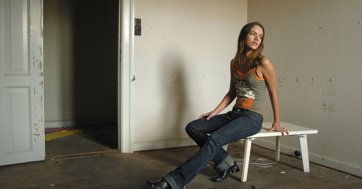 The door to the room of the petrified woman is closed! How can I open it? - Slim dreamy woman sitting on table in old apartment The door to the room of the petrified woman is closed! How can I open it? - Slim dreamy woman sitting on table in old apartment