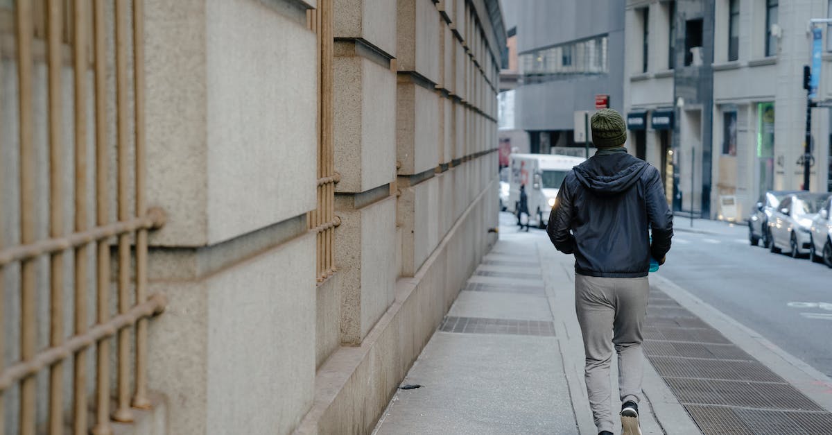 The fastest way to run Starcraft 2 offline? - Unrecognizable man running on sidewalk in city