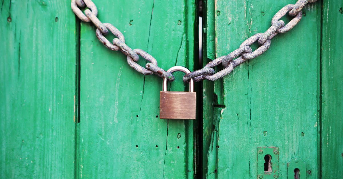 The first "staff only" door is locked - how to progress? - Brass-colored Metal Padlock With Chain