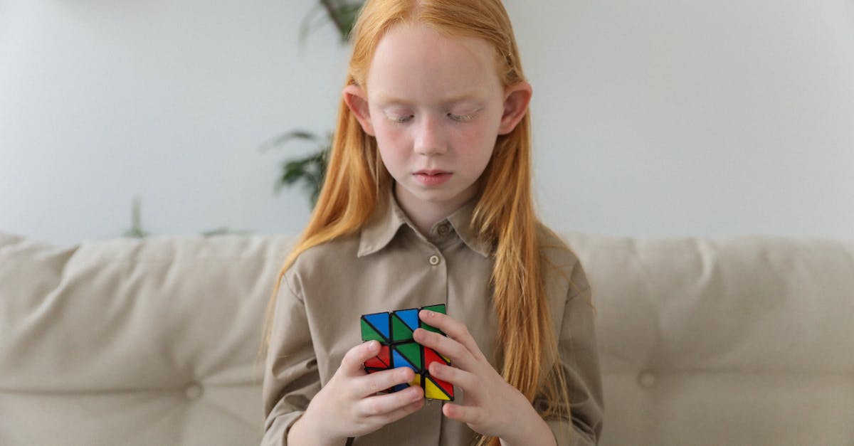 The game pauses but the menu doesn't appear? - Cute girl thinking over bright puzzle cube The game pauses but the menu doesn't appear? - Cute girl thinking over bright puzzle cube