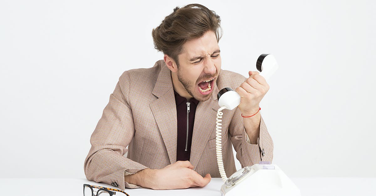 The Mad God's Bargain: Missing reward? - Man Wearing Brown Suit Jacket Mocking on White Telephone The Mad God's Bargain: Missing reward? - Man Wearing Brown Suit Jacket Mocking on White Telephone