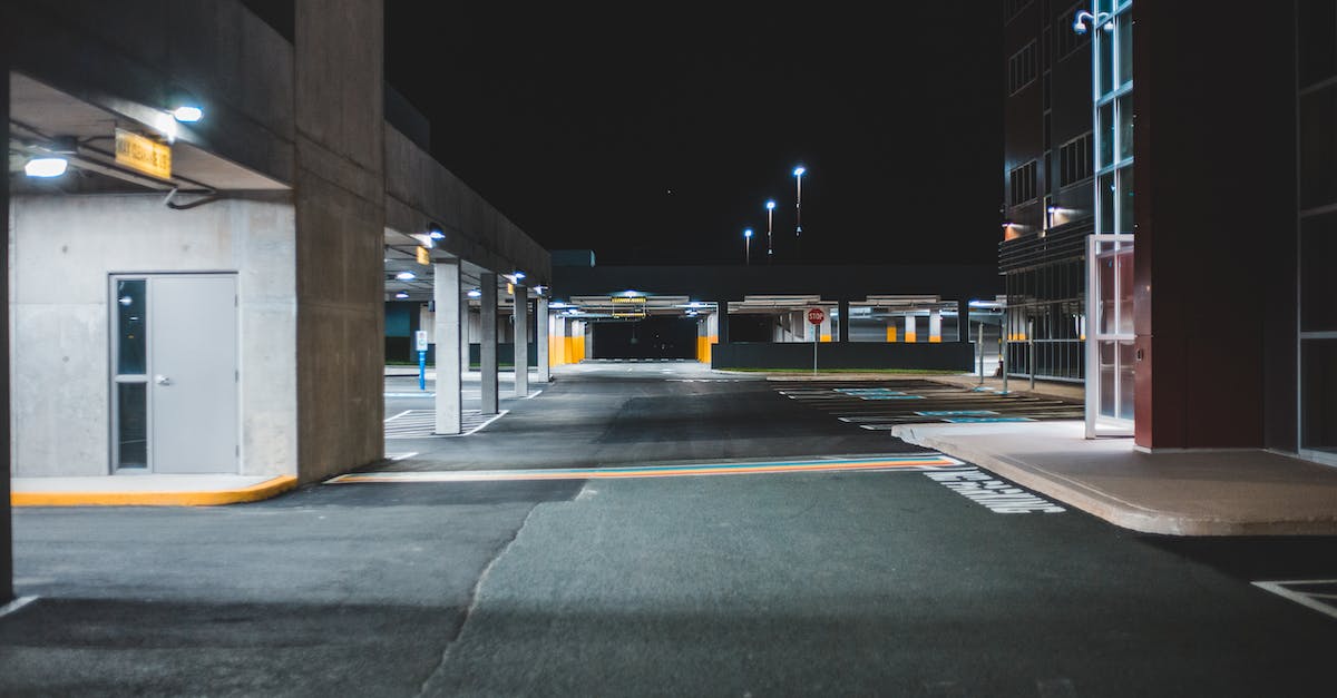 The minimal path to build all Warframes? [closed] - Illuminated empty parking lot with concrete walls