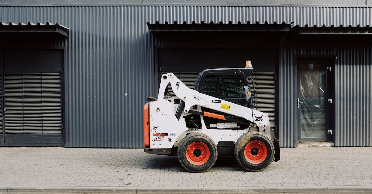 The minimal path to build all Warframes? [closed] - Small truck parked near warehouse on sidewalk on street