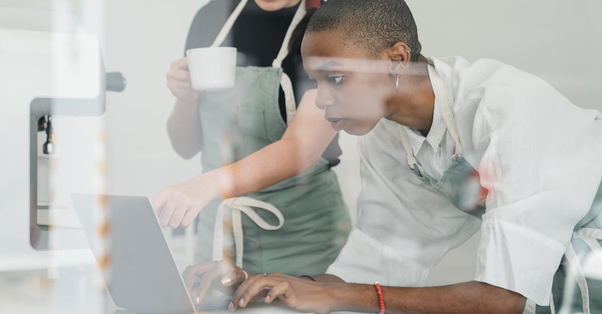 The point of upgrading exotics through xur? - Colleagues at coffee shop using special program on laptop together The point of upgrading exotics through xur? - Colleagues at coffee shop using special program on laptop together