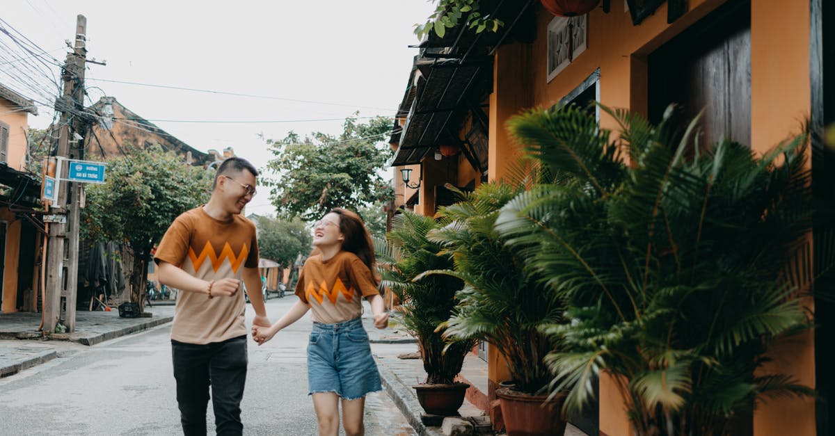 The same artifacts reappearing in Temple Run 2 - Cheerful Asian couple running on street The same artifacts reappearing in Temple Run 2 - Cheerful Asian couple running on street
