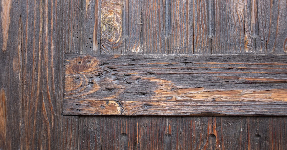 The strange wall or background in the cavern layer of Terrarria - Textured background of weathered brown aged wooden wall with scratches and holes differently directed boards