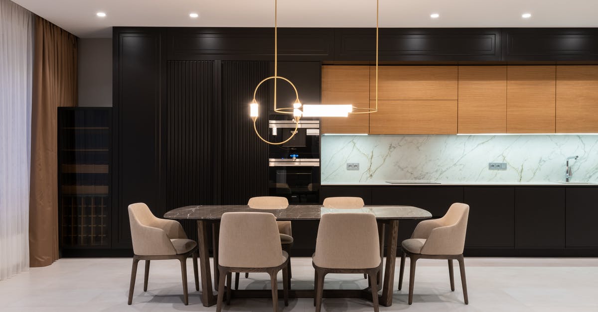 This is not valid housing [duplicate] - Flat with table and chairs near open kitchen