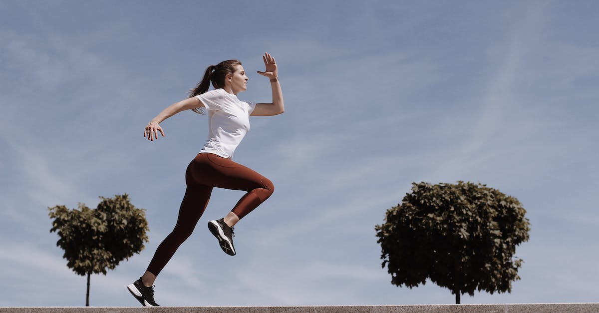 This program is running low on memory - Woman in White Shirt and Leggings Running This program is running low on memory - Woman in White Shirt and Leggings Running