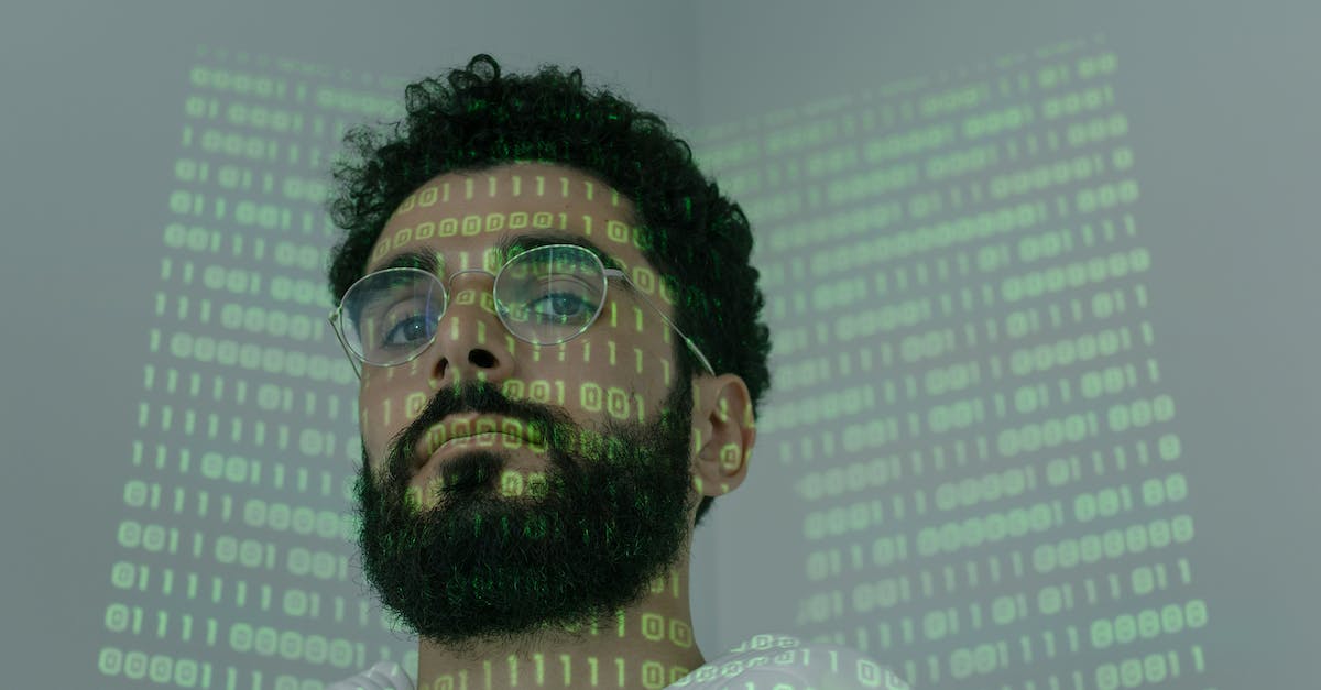 This program is running low on memory - Man With Binary Code Projected on His Face This program is running low on memory - Man With Binary Code Projected on His Face