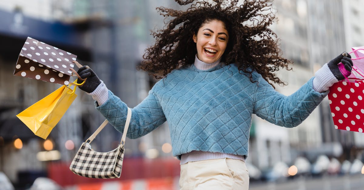 Time during which steam prevents the sale of items unless I buy more games - Happy woman jumping with shopping bags Time during which steam prevents the sale of items unless I buy more games - Happy woman jumping with shopping bags