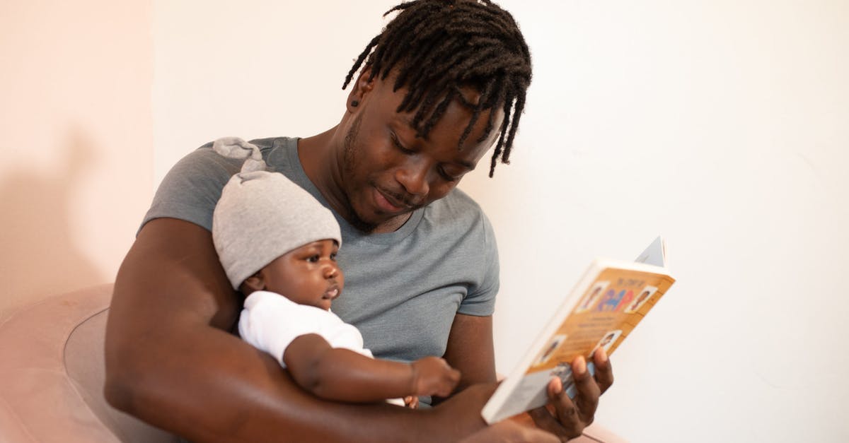 Time to deliver a baby [duplicate] - Man in Gray Shirt Holding Baby in White Onesie