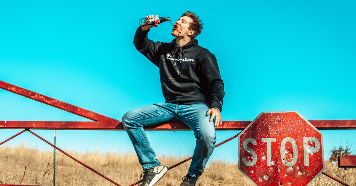 Titanfall 2/Apex Legends Stop Refreshing Screen After Clicking Out of it - Man Sitting on Metal Fence Drinking Soda