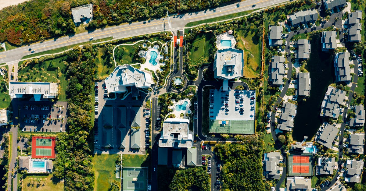 Too many hauling routes - Aerial view of residential buildings near road in small town