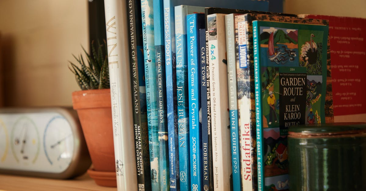 Total War: Warhammer, Difference between story and grand campaign - Wooden shelf filled with different interesting books near pots with green plants at home Total War: Warhammer, Difference between story and grand campaign - Wooden shelf filled with different interesting books near pots with green plants at home