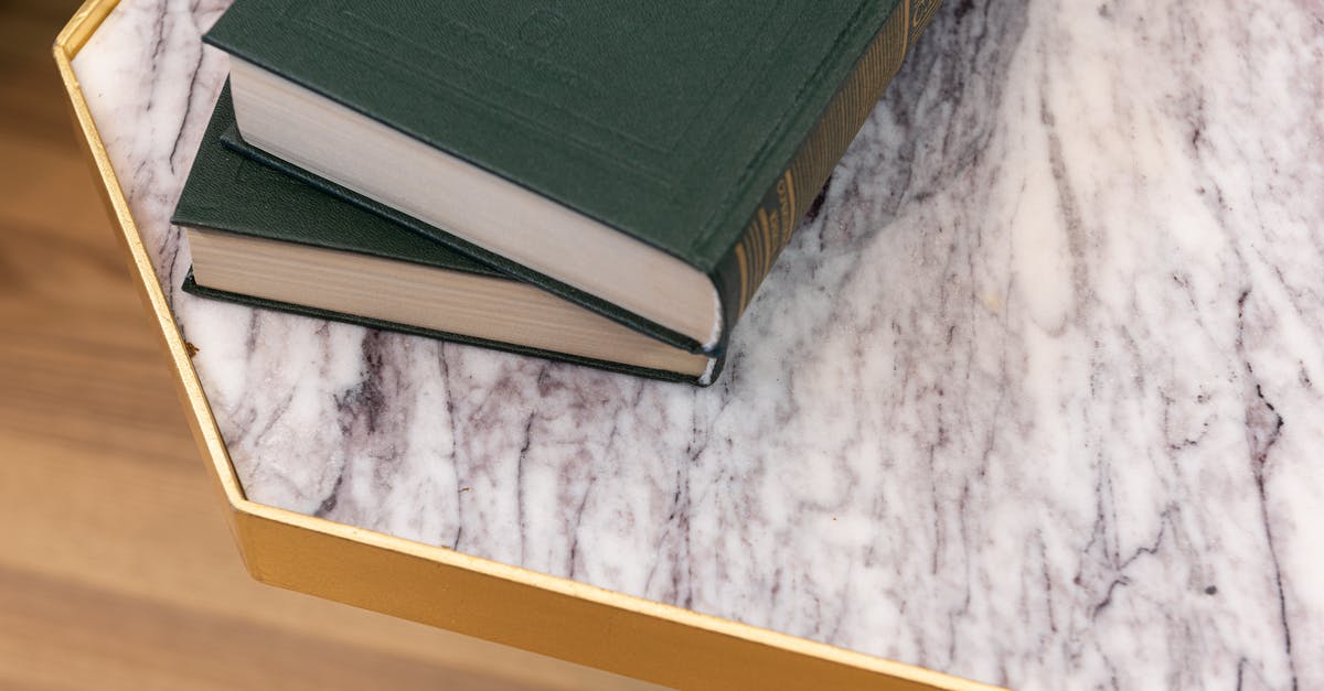 Transferring Data from old to new PS3 - Old books placed on marble table