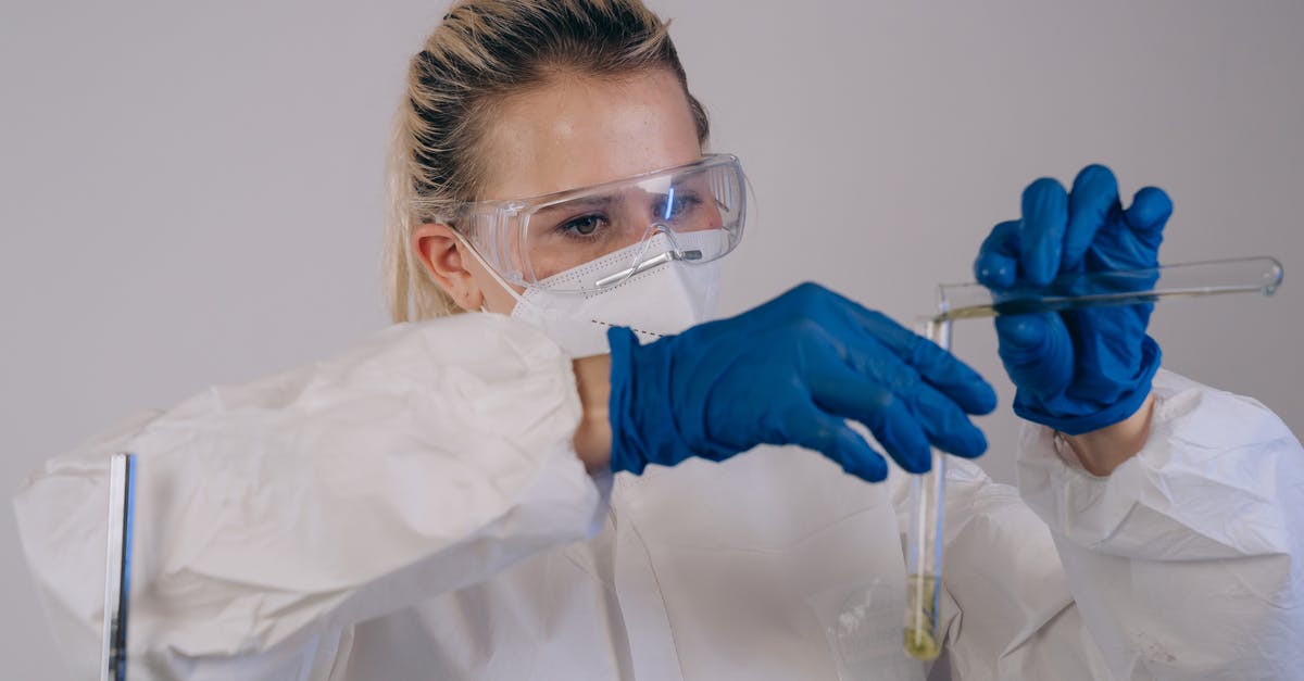 Transferring Fallout 4 Saves (PS4) - A Person Transferring Candle Wax on an Empty Glass Bottle