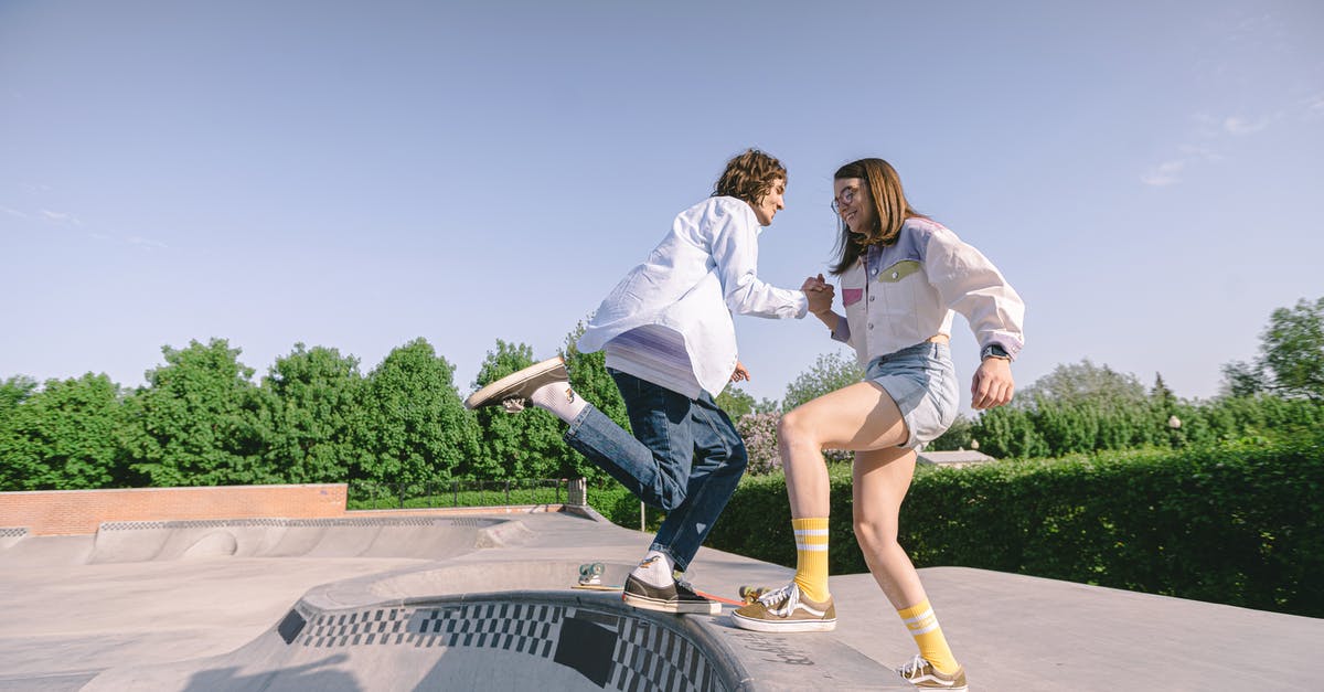 Treasure maps not helping - A Woman Pulling a Man at a Skate Park
