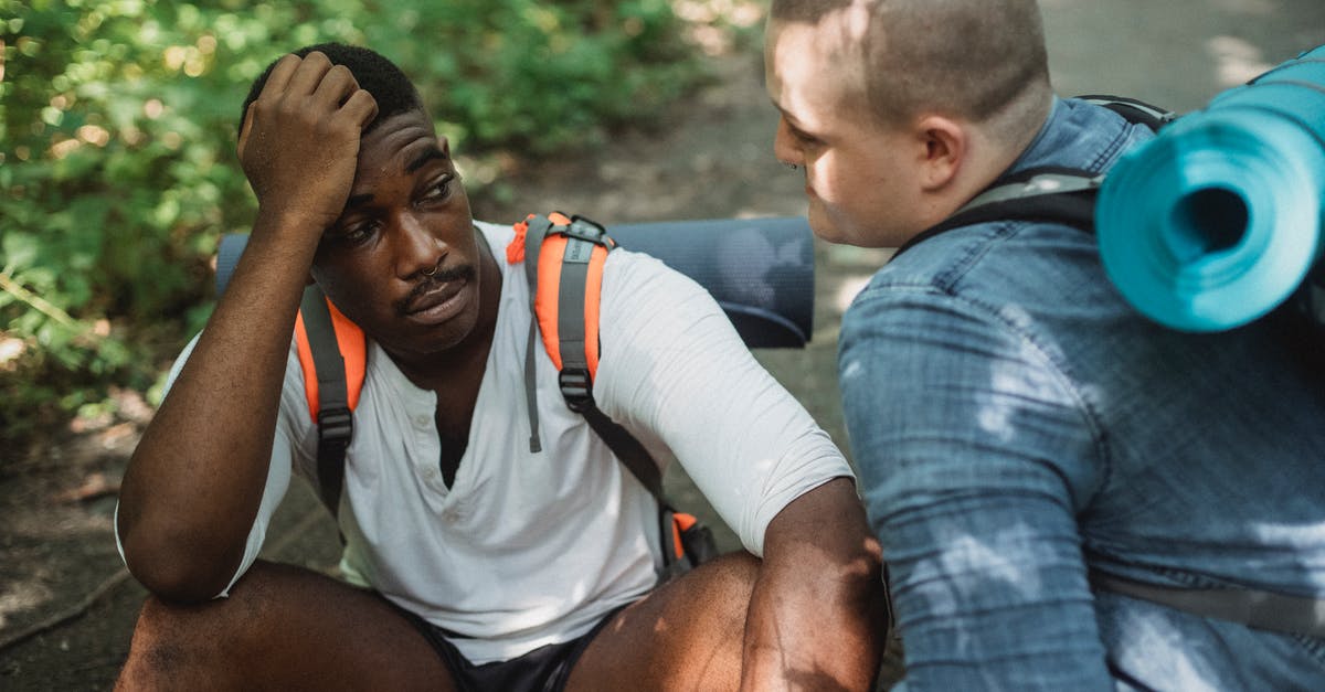 Trouble with Guard Break - Frustrated black man talking to friend while travelling together