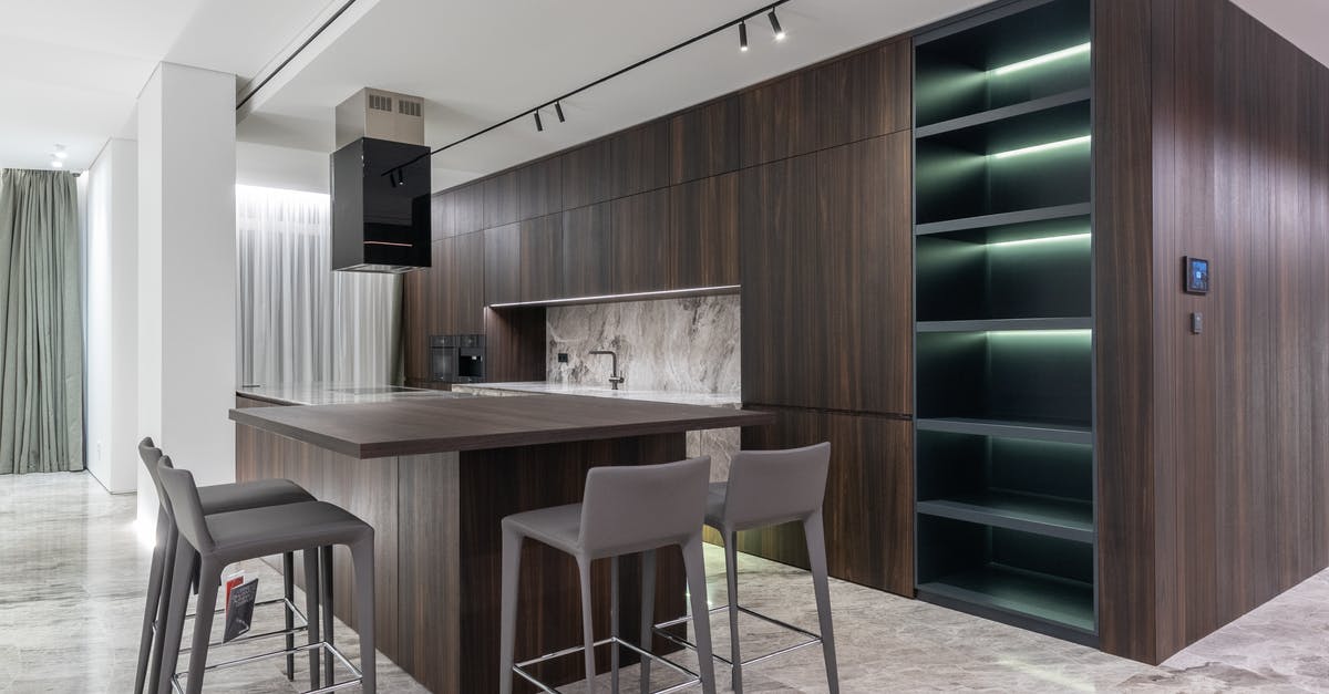 Trying to upgrade Premium Residential Zones to Luxury - Modern interior design of contemporary spacious kitchen with dining zone and wooden furniture in apartment Trying to upgrade Premium Residential Zones to Luxury - Modern interior design of contemporary spacious kitchen with dining zone and wooden furniture in apartment