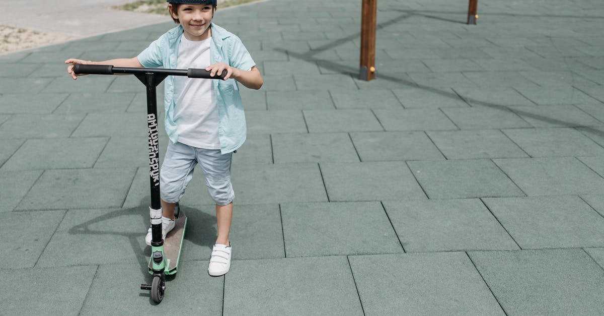 Um, but I have a portal? - Boy in White T-shirt and Blue Shorts Riding Kick Scooter Um, but I have a portal? - Boy in White T-shirt and Blue Shorts Riding Kick Scooter