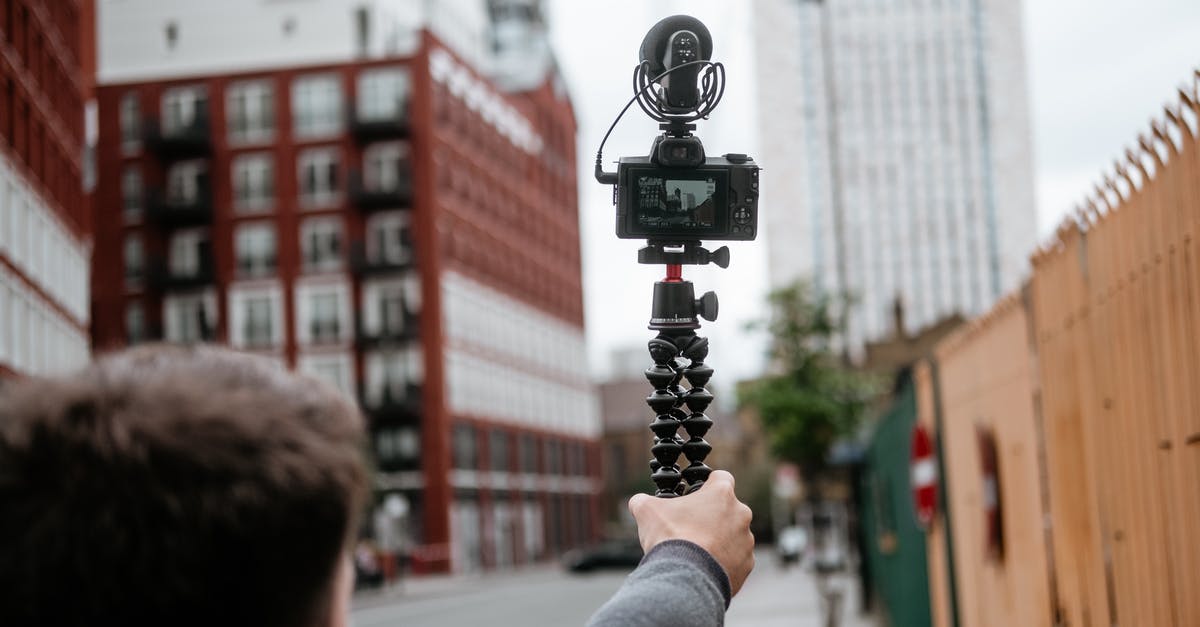 Unable To Capture The Last City in a Region? - Crop anonymous male recording video of town with modern buildings with digital photo camera in soft focus Unable To Capture The Last City in a Region? - Crop anonymous male recording video of town with modern buildings with digital photo camera in soft focus