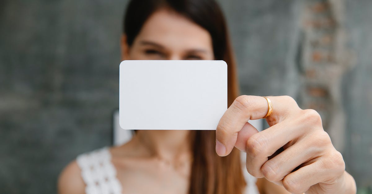 Unable to clear a mission to "buy something new in the stash"? - Young blurred female showing white blank business card and looking at camera in light room Unable to clear a mission to "buy something new in the stash"? - Young blurred female showing white blank business card and looking at camera in light room