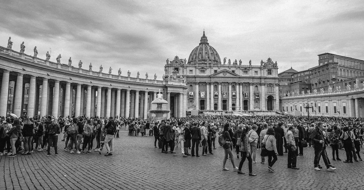 Unable to collect cobblestone after a while - People Walking Around a Building in Grayscale Photography