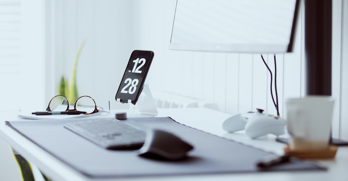 Unable to join this clan at the time - A Cell Phone and Eyeglasses on a Table Unable to join this clan at the time - A Cell Phone and Eyeglasses on a Table