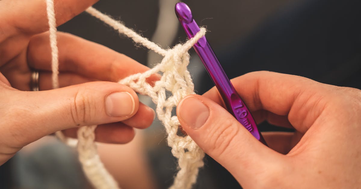 Un-Known Crafting Recipe? - Person Holding Purple Crochet Hook and White Yarn Un-Known Crafting Recipe? - Person Holding Purple Crochet Hook and White Yarn