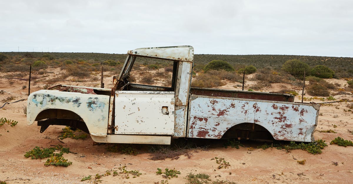 Unknown quest area in desert - Rusty abandoned car near fence in desert