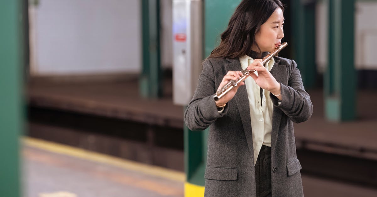 Unstable FPS while playing Metro Exodus - Enhanced Edition - Asian woman in suit playing flute in subway