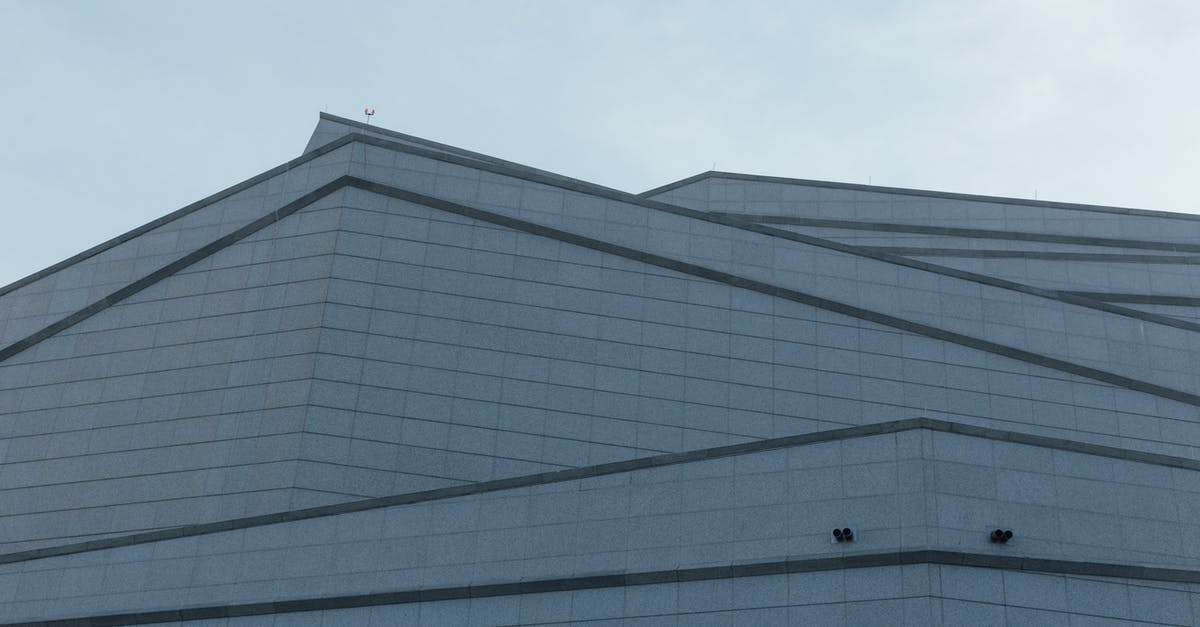 Upgrading vs building new items - White and Gray Concrete Building Under Blue Sky