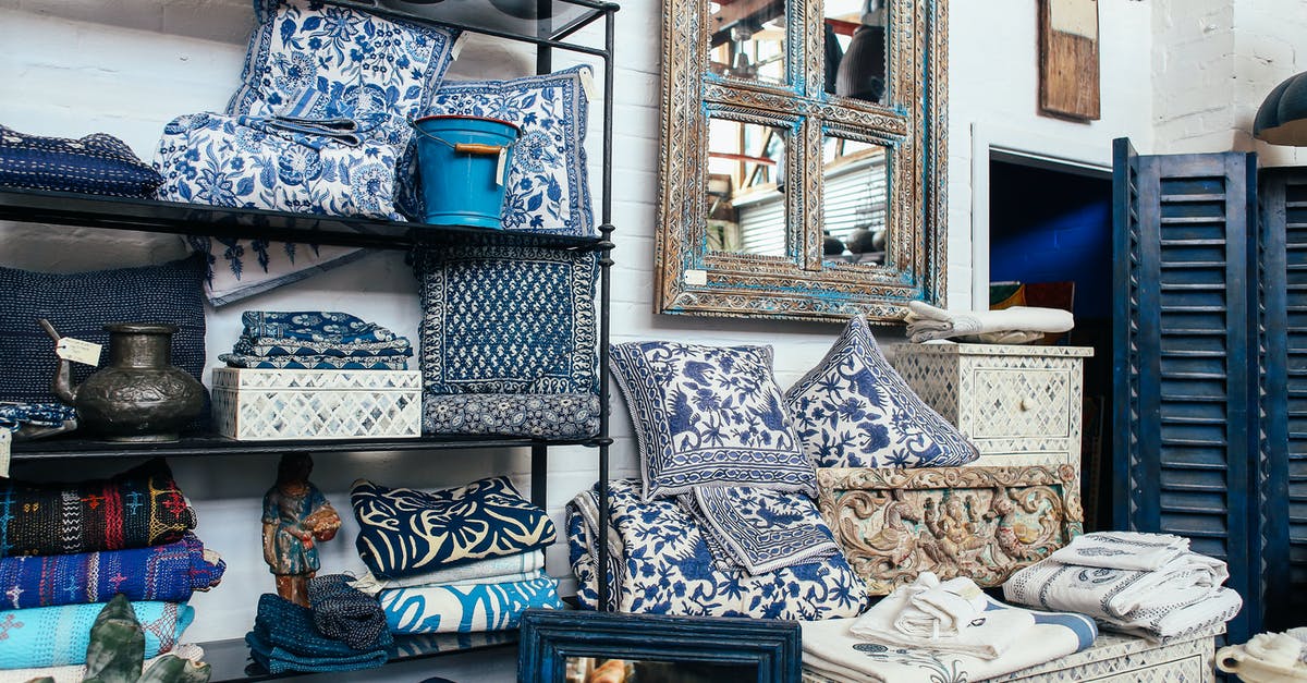 Uplay Shop Tab Missing - Blue and White Floral Throw Pillows on Blue Couch