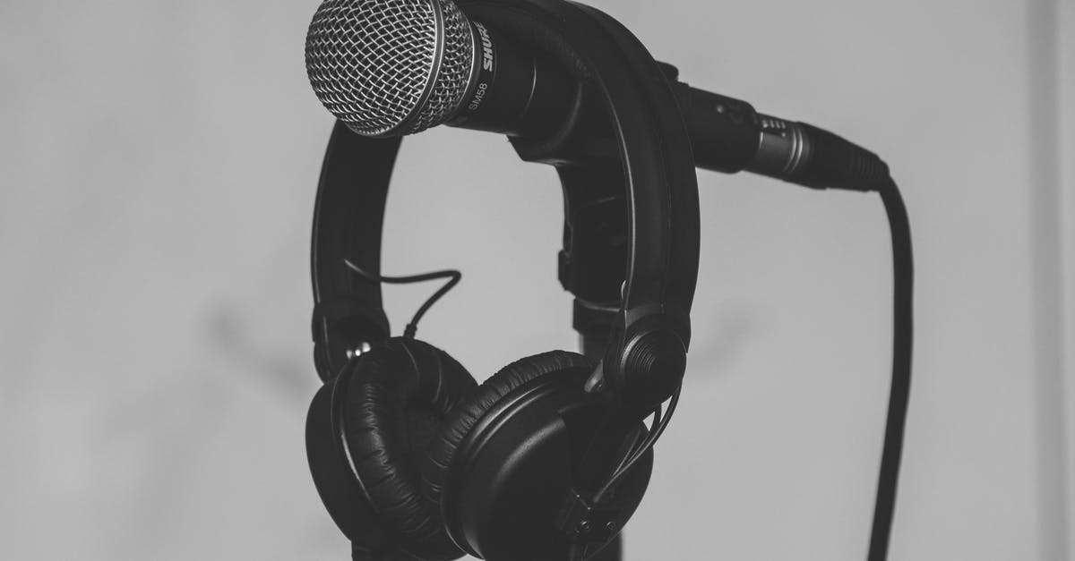 USB MIC w/ 3.5mm Headphones - Black Headset Hanging on Black and Gray Microphone