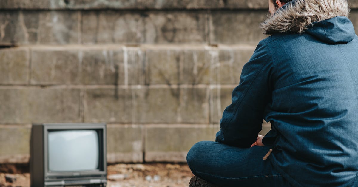 Used 'disable' command on NPC - how do I get him back? - Crop man sitting against vintage TV on street Used 'disable' command on NPC - how do I get him back? - Crop man sitting against vintage TV on street