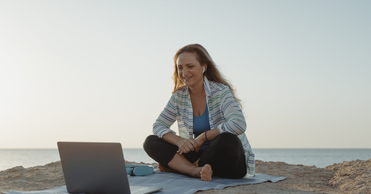 Usefulness of SSTOs and spaceplanes - Woman in White Long Sleeve Shirt and Black Pants Sitting on Gray Sand Using Macbook Usefulness of SSTOs and spaceplanes - Woman in White Long Sleeve Shirt and Black Pants Sitting on Gray Sand Using Macbook