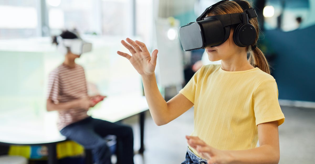 Using a command to test when a player eats something [duplicate] - Young female in VR glasses standing in light room and testing new device