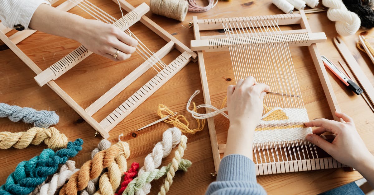 Using materials to craft armor - Photo of Two Person's Hands Weaving Using materials to craft armor - Photo of Two Person's Hands Weaving