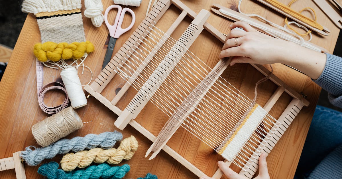 Using materials to craft armor - Top View Photo of Person Weaving Using materials to craft armor - Top View Photo of Person Weaving