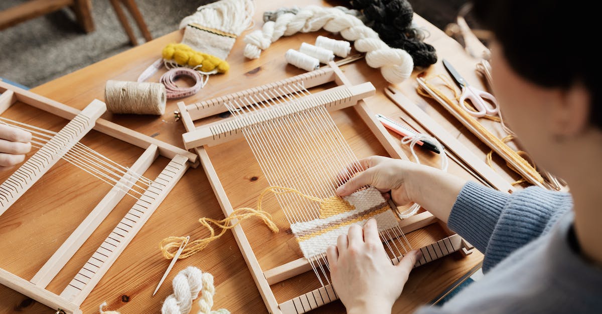 Using materials to craft armor - Photo of Person Weaving Using materials to craft armor - Photo of Person Weaving