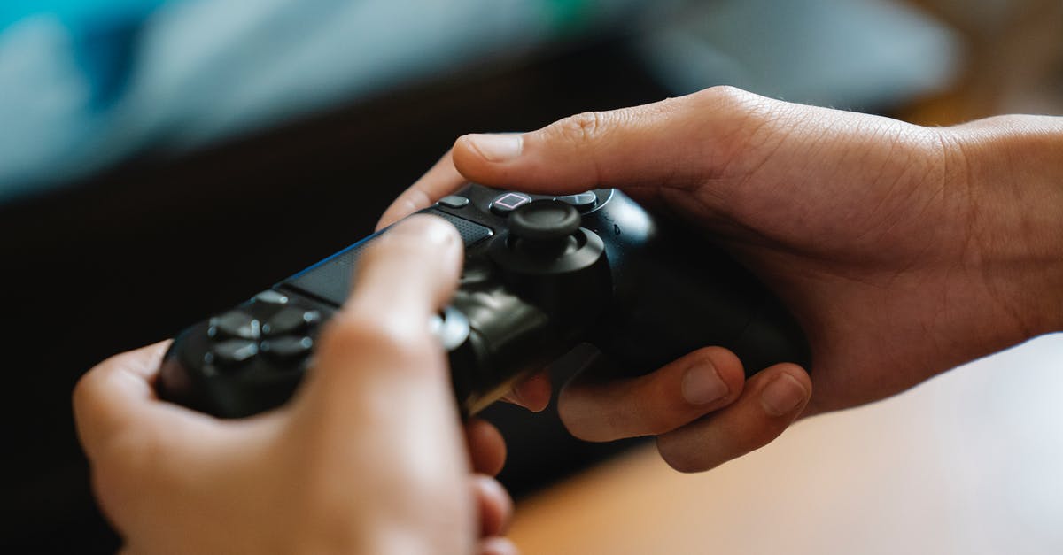 Using second hand Skylander games - Crop unrecognizable man with modern gamepad playing video game while having free time at home Using second hand Skylander games - Crop unrecognizable man with modern gamepad playing video game while having free time at home