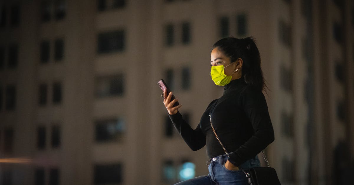 Using SOCKS with Minecraft - Woman in a Mask Using Phone on a Street at Night Using SOCKS with Minecraft - Woman in a Mask Using Phone on a Street at Night
