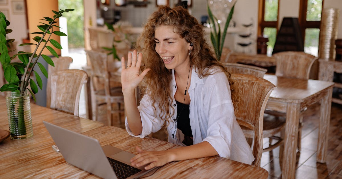 Using Wii U on wireless network with username and password - Woman in White Shirt Sitting on Chair in Front of Macbook Using Wii U on wireless network with username and password - Woman in White Shirt Sitting on Chair in Front of Macbook
