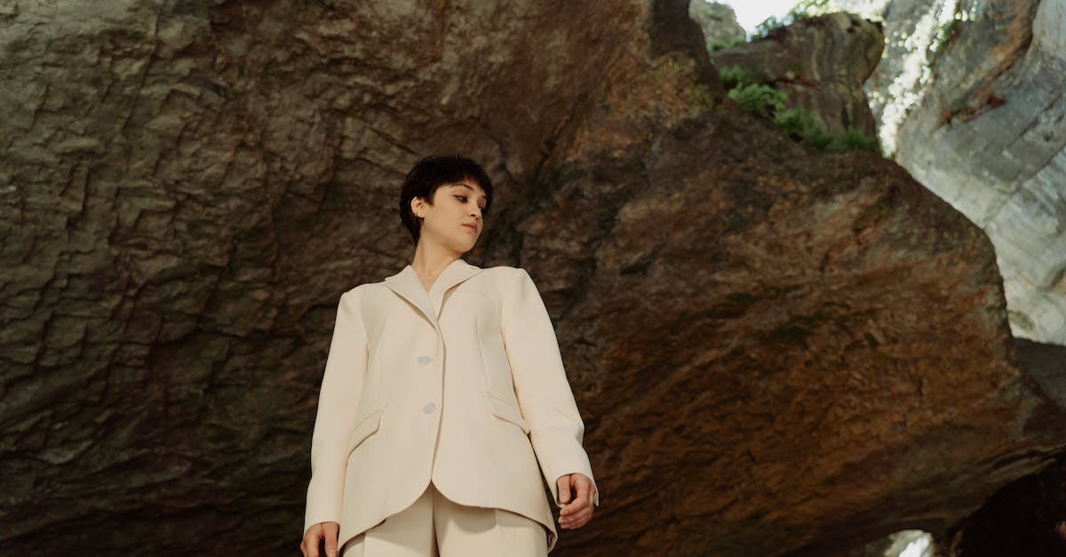 Uxie and Azelf Are Not Appearing in Nameless Cavern - Low-Angle Shot of a Woman Wearing a Blazer in a Cave Uxie and Azelf Are Not Appearing in Nameless Cavern - Low-Angle Shot of a Woman Wearing a Blazer in a Cave